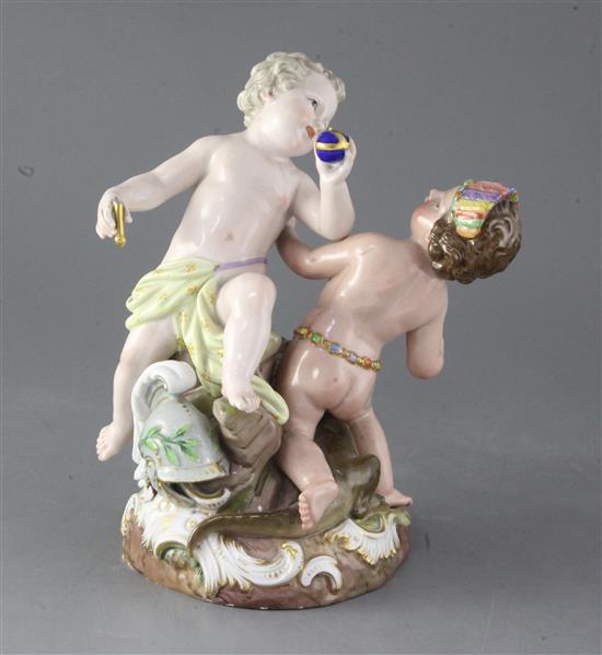 A Meissen group of two putti emblematic of Europe and America, height 24.3cm, losses